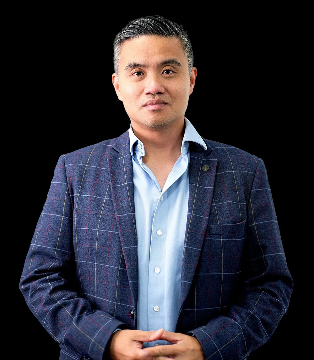 Professor Paul Lee in a blue plaid blazer